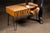 Vintage wooden library card catalog repurposed as a distinctive console or occasional table. The oak case features a...