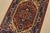 A traditional tribal Heriz rug hand-knotted with fine wool on a cotton foundation. This oriental rug features a central...