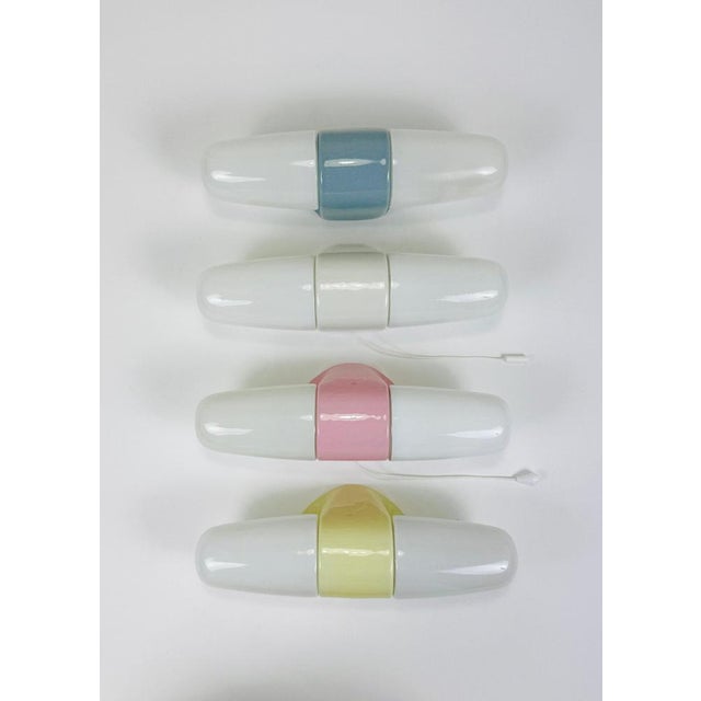 A midcentury modern double socket wall lamp / sconce dating back to the 1950s, designed by wilhelm wagenfeld. Its form...