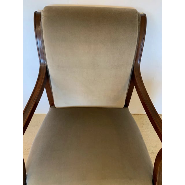 Regal Regency 19th century neoclassical mahogany and newly upholstered grey velvet arm chair having handsome brass stars...