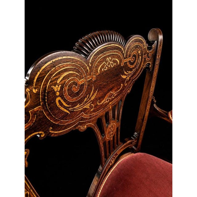 A highly decorative and unusual antique Edwardian mahogany armchair, dating to the early 20th century and distinguished by...