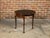 An English Georgian period demi-lune console table from the early 19th century, with flip top, leather inset and gilt...