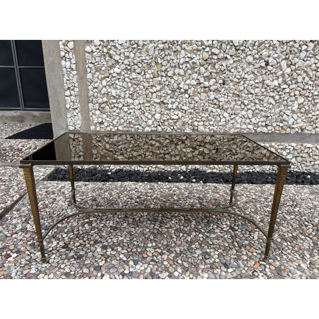 French Louis XVI Style Brass Cocktail Table. Offered is a beautifully designed French Louis XVI style patinated...