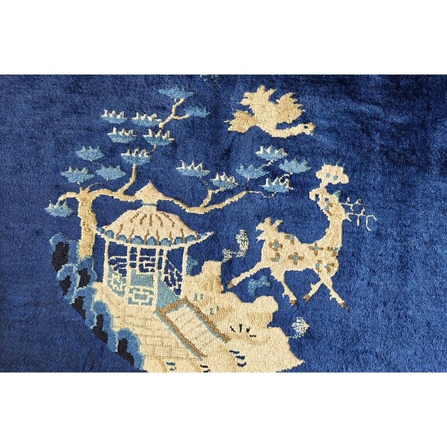 Antique Peking Chinese Floral Blue 1920s Rug, Circa Date: 1920s. This magnificent example of early 20th-century Chinese...