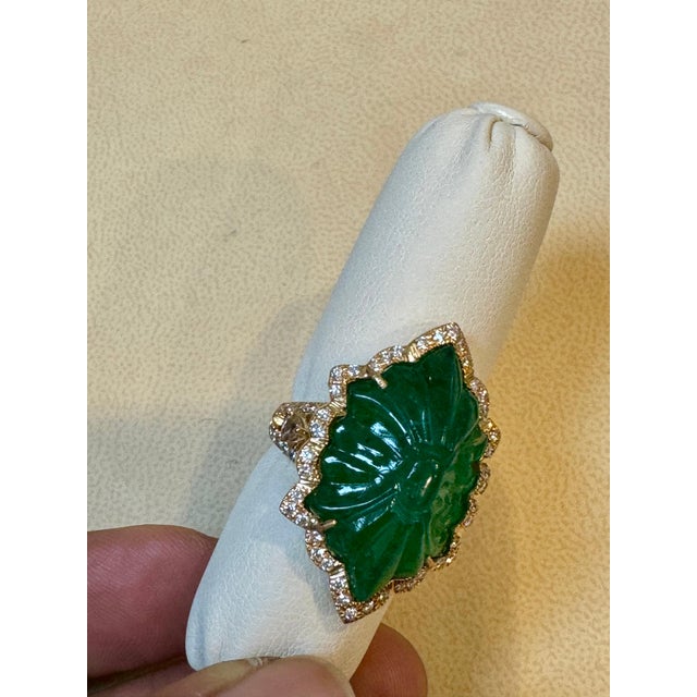Vintage 18 Karat Yellow Gold Ring Size 6.5 featuring a single solitaire natural carved emerald approximately 12 ct with...
