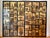 Magnificent Chinese export six-panel folding coromandel screen featuring gold recessed windows filled to the brim with...