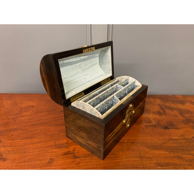 A charming mid Victorian period dome topped coromandel wood stationary casket. Of fine construction and embellished with...