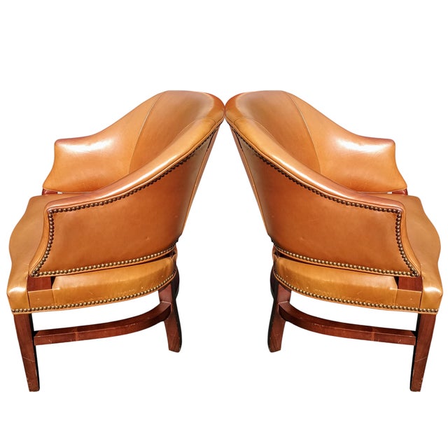 Crafted with quality American craftsmanship, these chairs feature rich, warm-toned leather upholstery accented with...