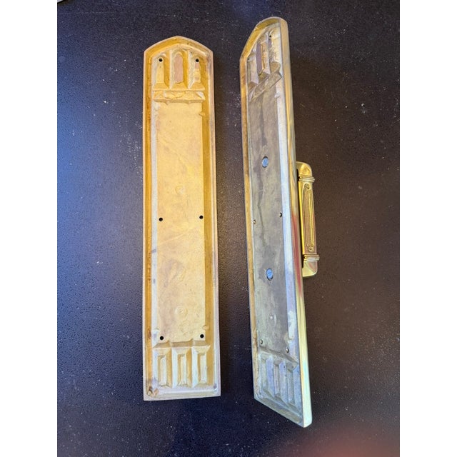 This product is a set of traditional Gothic style push pull door hardware made of brass. The hardware features a classic...