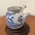 This Antique Japanese Kyushu Side-Handle Porcelain Teapot is a handmade piece showcasing a Shanshui scene and Chinese...