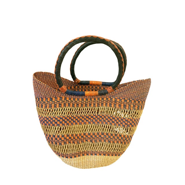 This African Bolga Basket from the Bolgatanga region of Ghana, inspired by Saint-Tropez French Riveria town, is of...