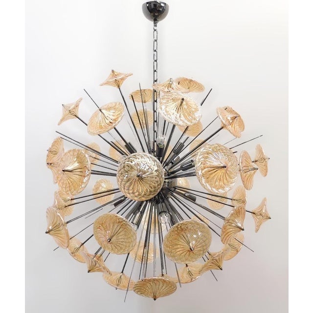 Italian modern Sputnik chandelier shown in Pyrex borosilicate glasses hand blown to produce a spiraled effect, mounted on...