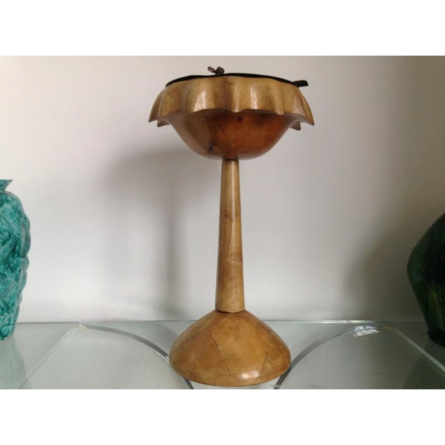 This standing ashtray was designed by Aldo Tura and manufactured in Italy. It is made from goatskin with a metal tray....