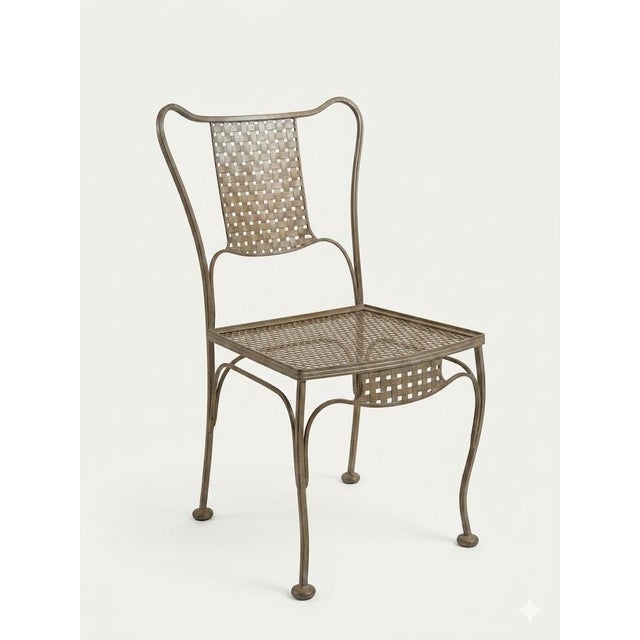 Woodard attributed wrought iron patio dining set. Beautiful and unique set has gracefully stood the test of time. Owned by...