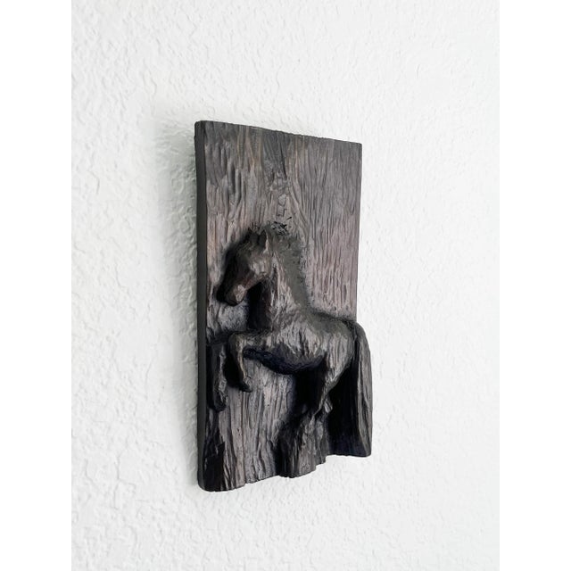 Figurative, Western style metal wall plaque art featuring a bucking horse with wood textured background. Original piece,...