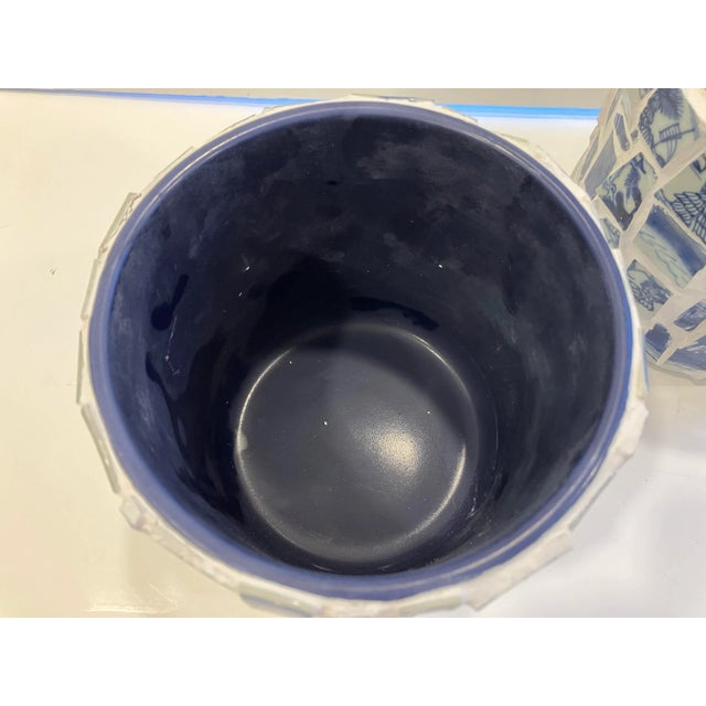 This pair of jardinieres is decorated with shards of antique Canton china Canton blue & white was exported from China...