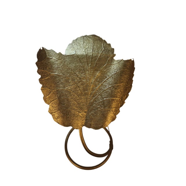 The Aesthetic: A masterclass in sculptural glamour, this 1970s "Lotus" leaf lamp embodies the transition from mid-century...