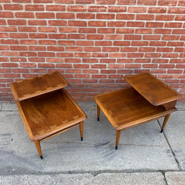 Pair of Lane “Acclaim” two-tier step tables designed by Andre Bus for Lane Furniture. A nice variation from the standard...