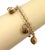 This beautiful charm bracelet is crafted from solid 14k yellow gold and features a polished, elegant finish. The design...