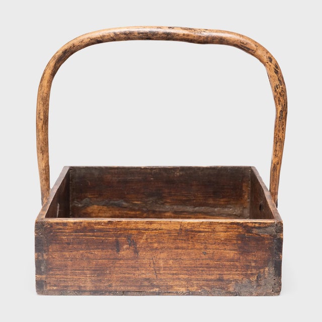This antique Chinese merchant's tray from the early 20th century charms with an asymmetrical form and well-loved, wabi-...