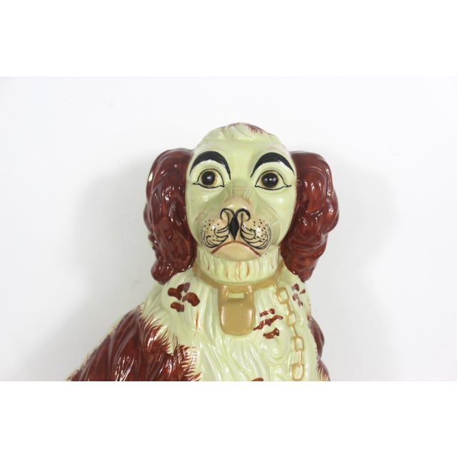 Vintage very large and heavy Staffordshire spaniel dog. This piece really makes a statement and has no chips or cracks. A...