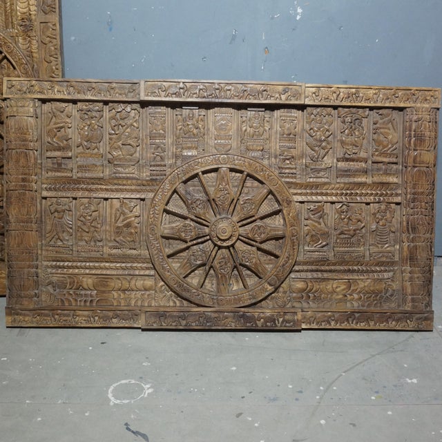 Inspired by the legendary Konark Sun Temple of Odisha, this vintage hand-carved wooden chariot wheel panel is a striking...