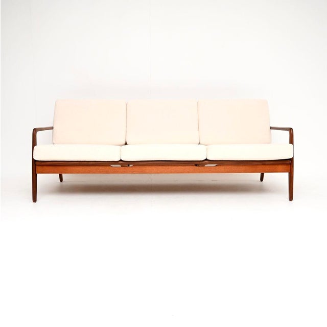 A rare and absolutely stunning Danish vintage sofa bed by Arne Vodder for Vamo Mobelfabrik. It was made in Denmark, and...