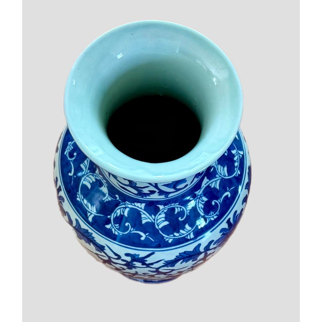 Beautiful blue and cream colored traditional chinese vase. Standing tall at 16 1/2 inches, this vase is adorned with a...