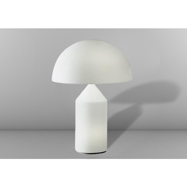 The beautiful and iconic Atollo 235 table lamp, designed by Vico Magistretti for the Italian company O Luce, won the...