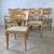 An iconic milestone in American mid-century design, this set of six vintage Heywood-Wakefield dining chairs beautifully...