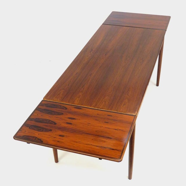 Extra large mid century modern extendable rosewood dining table from the 1960s. This vintage dining table was crafted from...