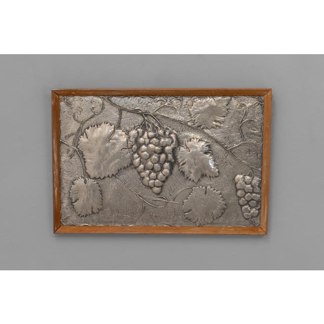 Decorative framed pressed pewter panel of grapes on a vine. Circa 1950. (Signed. Saunders?)