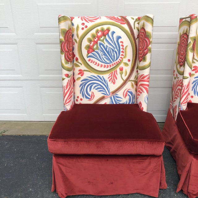 Striking pair of custom armless wing back chairs in persimmon velvet and a multi colored tapestry. Ideal for any entrance...