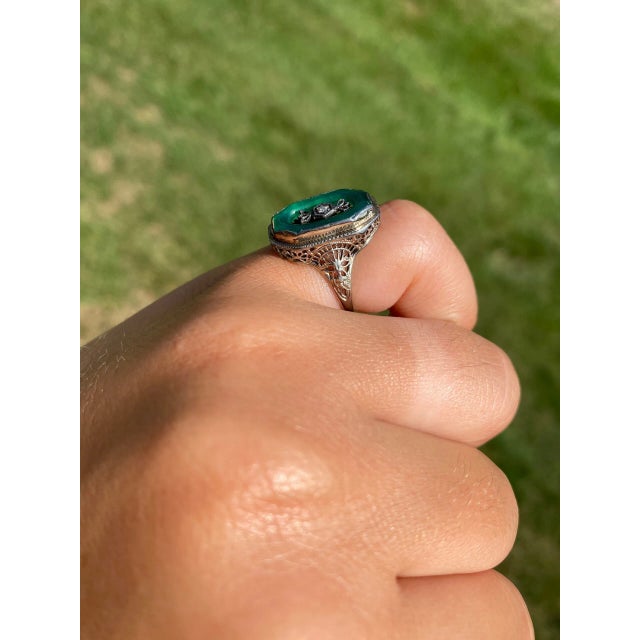 The Estelle Avenue Antique Filigree Cocktail Ring set with Chalcedony and Diamond. This uniquely designed ring is crafted...
