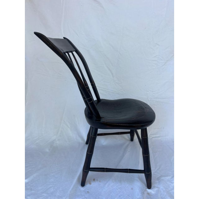 Unique Windsor Chair with accentuated back angle. The seat is unusually thick with a comfortable depression carved into...