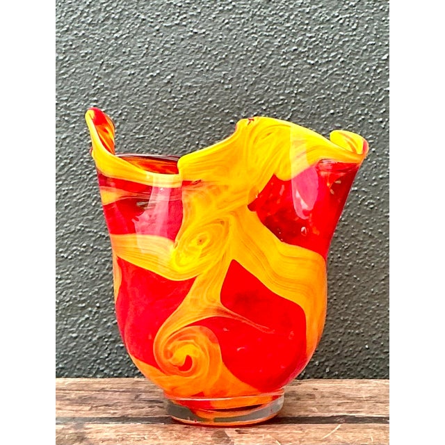 Elevate your décor with this captivating vintage art glass vase, masterfully crafted in the esteemed tradition of Murano....