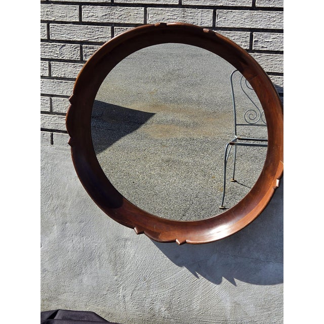 The 1920 regency style solid walnut handmade American round mirror is a stunning piece of antique decor for any room. With...
