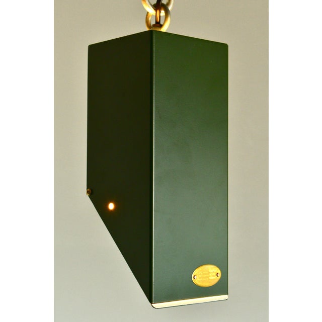 Using a barn door on a pendant lamp, this lamp can be dimmed with ease at a fingertip. Pressed and powder coated steel,...