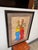 Design Plus Gallery presents a Signed Artwork by Gilberto Grimaldo. The colorful piece is pleasant and shows two female...