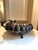 Vintage silver-plated scallop shell warming dish, often used for serving seafood or as a decorative centerpiece, features...