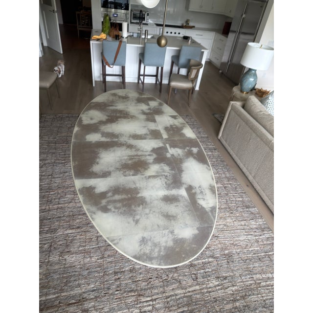 An exceptional, contemporary masterpiece by luxury furniture designer Julian Chichester, the Dakota Oval Dining Table...