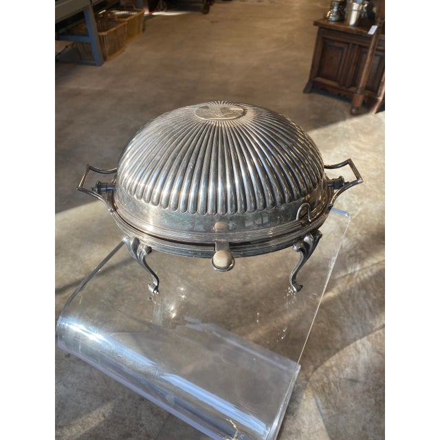 Large silver plated breakfast server with roll top ribbed dome. Armorial engraving to the top and marked accordingly to...