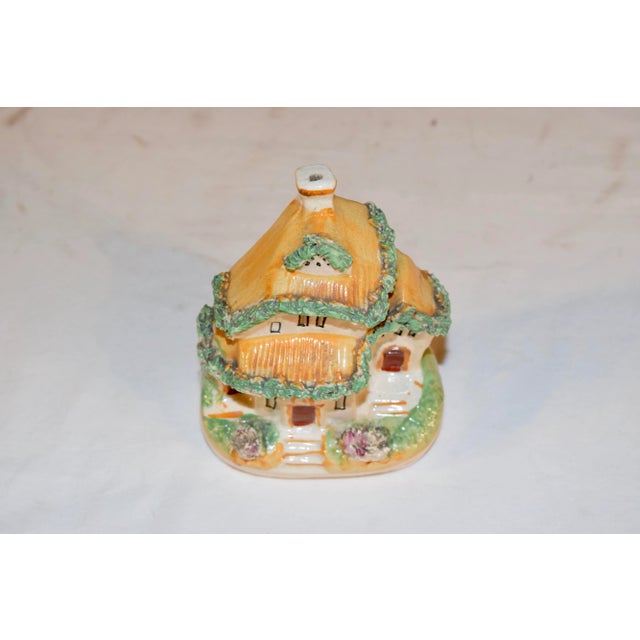 19th century Staffordshire cottage. Very folky with a "thatched" roof in gold and flocked accents.