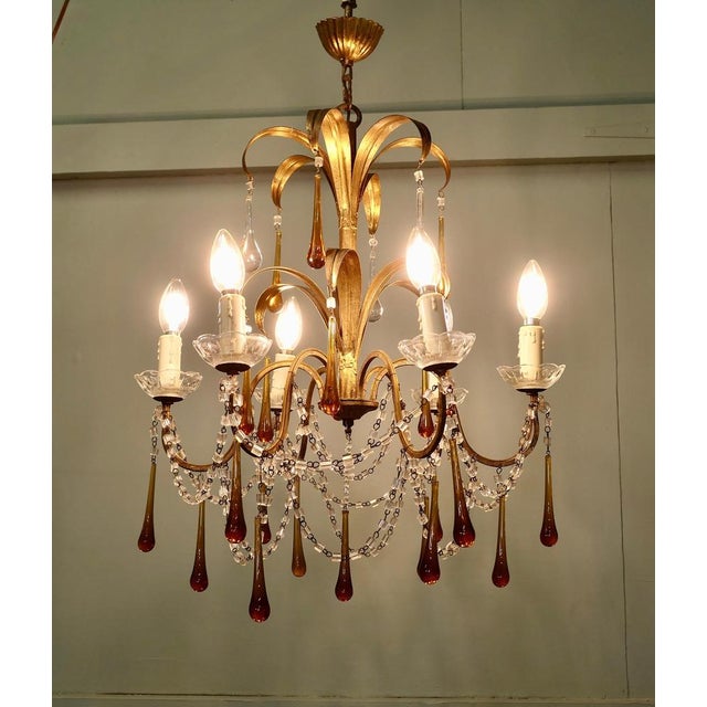 French Gilt Tolewear Chandelier Hung with Amber Crystal Teardrops This is a stunning piece, the gilded toleware frame is...