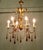 French Gilt Tolewear Chandelier Hung with Amber Crystal Teardrops This is a stunning piece, the gilded toleware frame is...