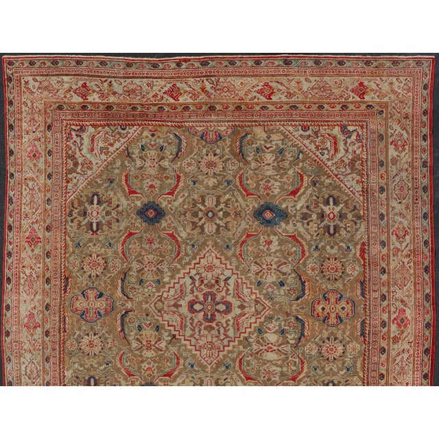 Measures: 10'8 x 13'4 Antique Persian Sultanabad Mahal Carpet with Geometric Design In Green's and Red. Keivan Woven Arts...