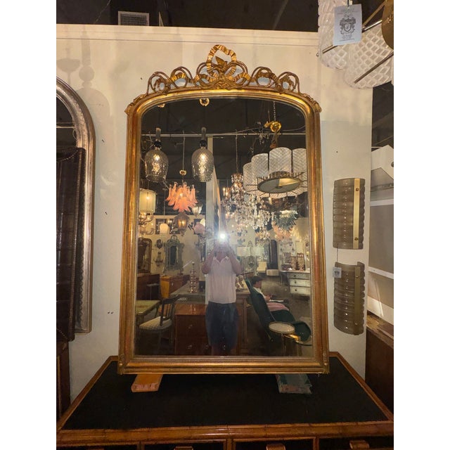 The 19th c. French Louis XV Giltwood Mirror is a luxurious and elegant piece of home décor that would be a perfect...