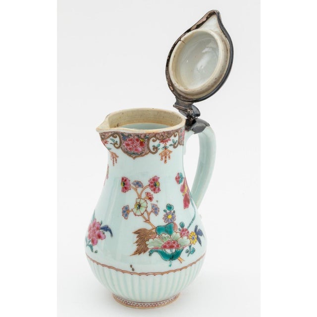 Chinese Export Famille Rose Porcelain Silver Mounted Ewer, circa 1760, with floral decoration and gilt embellishments....