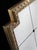 Handcrafted in Italy, this wall mirror features a solid wood frame finished in brushed 24k gold leaf with a decorative...