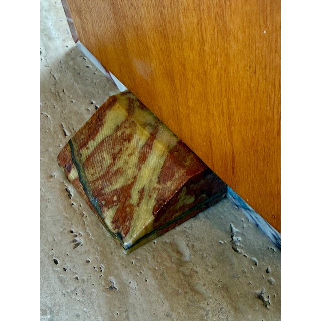 Elegant Italian picture frame crafted from richly veined red marble, featuring a bold beveled geometric profile. The...